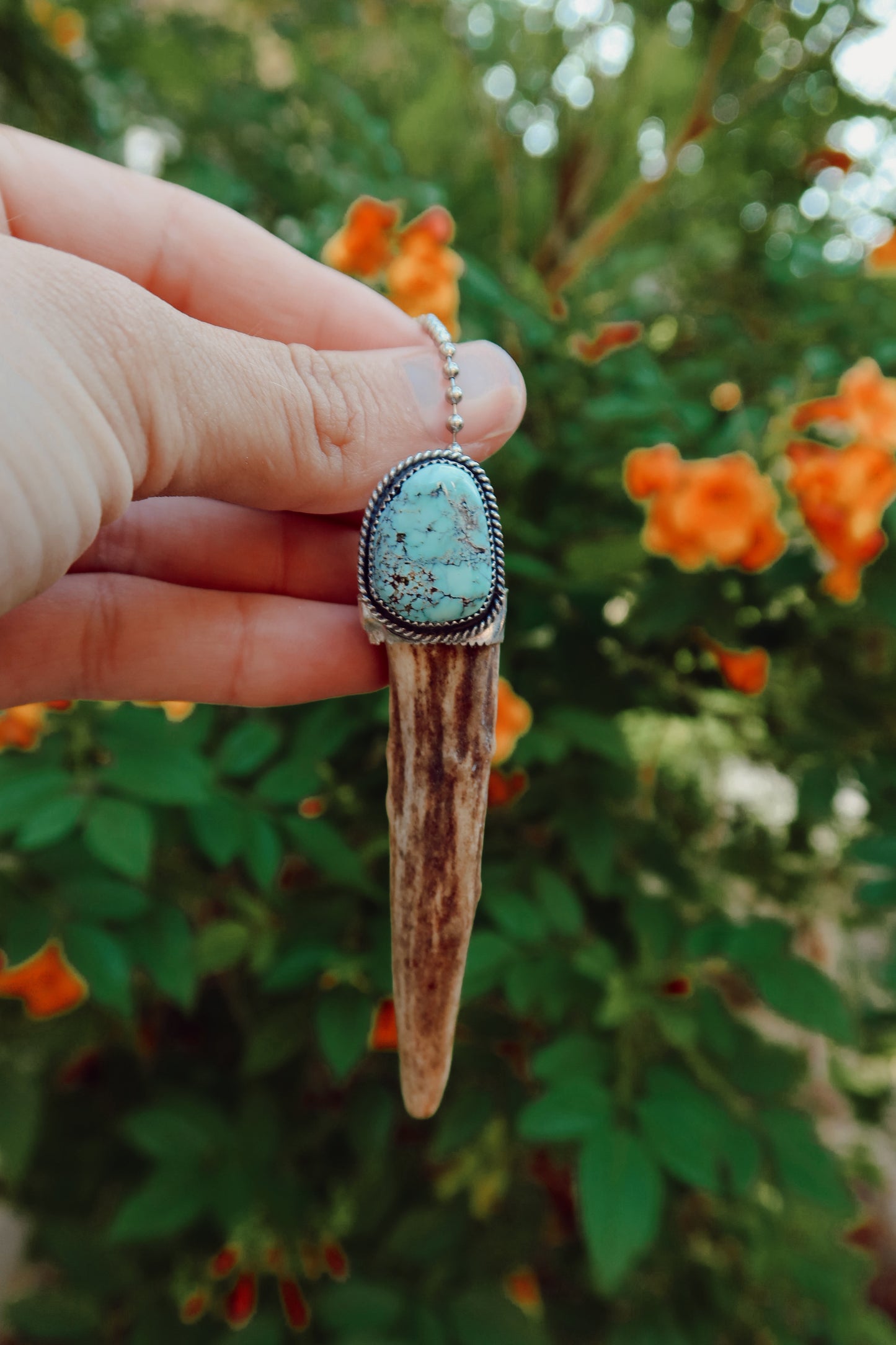 Carry a touch of enchantment with this whimsical Sterling Silver and Turquoise Antler Tip Keychain, lovingly handcrafted in South Texas. Let this magical little charm dance from your keys, dangle from your purse, or nestle close to your heart as a pendant. A sprinkle of south Texas charm wherever you wander.