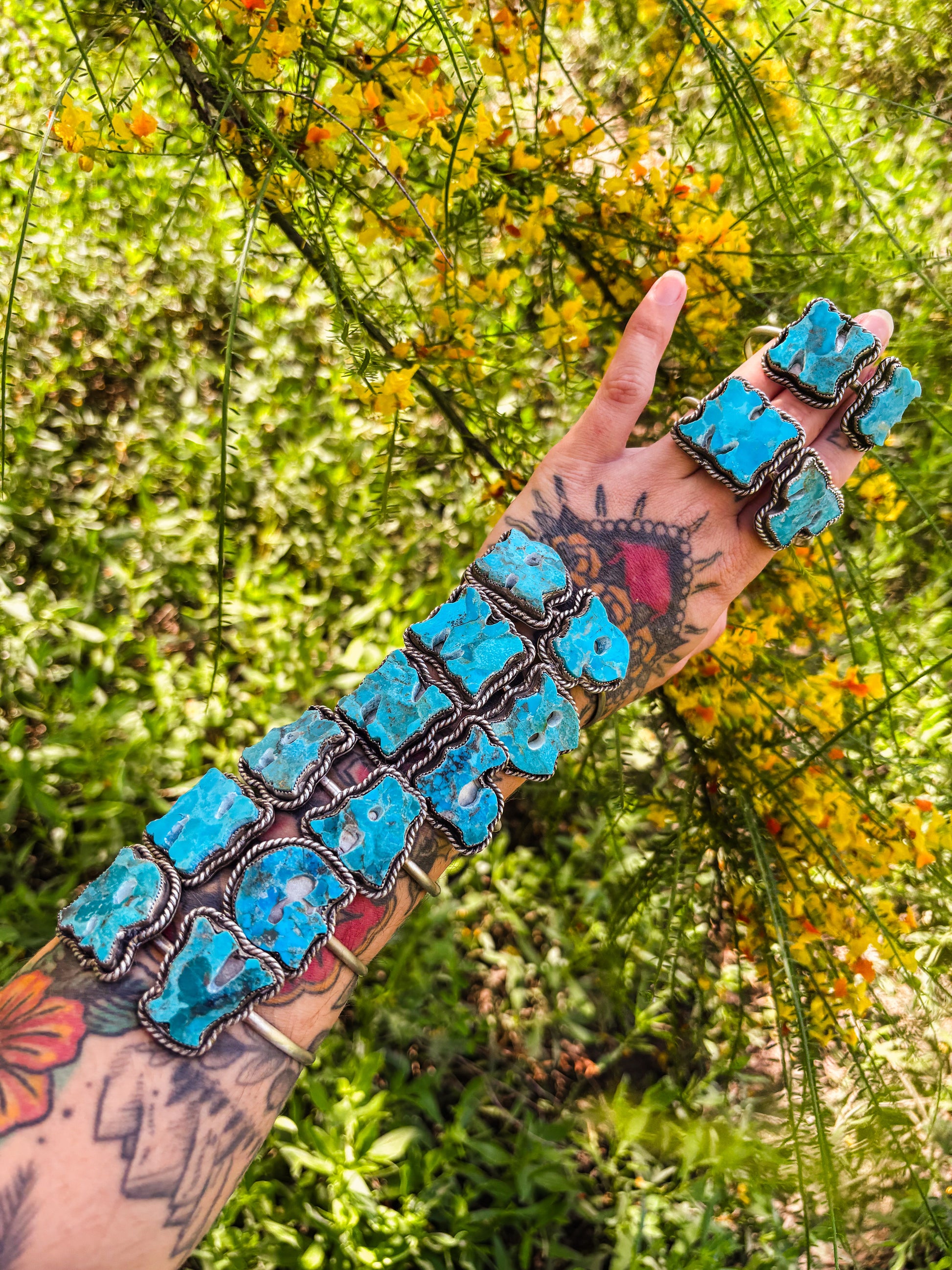 Elevate your wrist with this stunning preorder piece featuring compressed Kingman turquoise. This double initial cuff showcases hand-cut western turquoise letters creating a personalized statement bracelet with southwestern charm. Each letter is meticulously crafted from compressed Kingman Turquoise (different shades of Kingman turquoise compressed into a single brick-not dyed), set against a polished sterling silver !&nbsp;