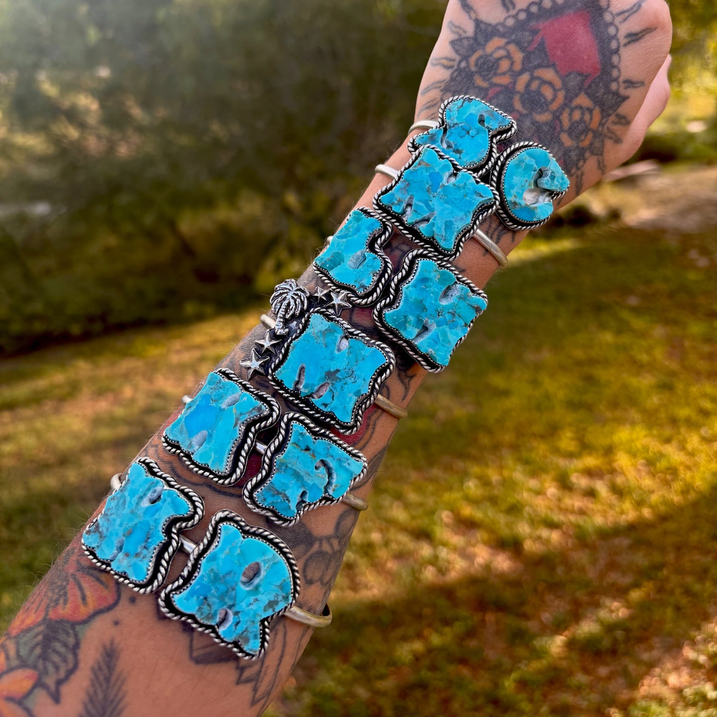 Elevate your wrist with this stunning preorder piece featuring compressed Kingman turquoise. This double initial cuff showcases hand-cut western turquoise letters creating a personalized statement bracelet with southwestern charm. Each letter is meticulously crafted from compressed Kingman Turquoise (different shades of Kingman turquoise compressed into a single brick-not dyed), set against a polished sterling silver cuff base. ETA is 6-7 weeks