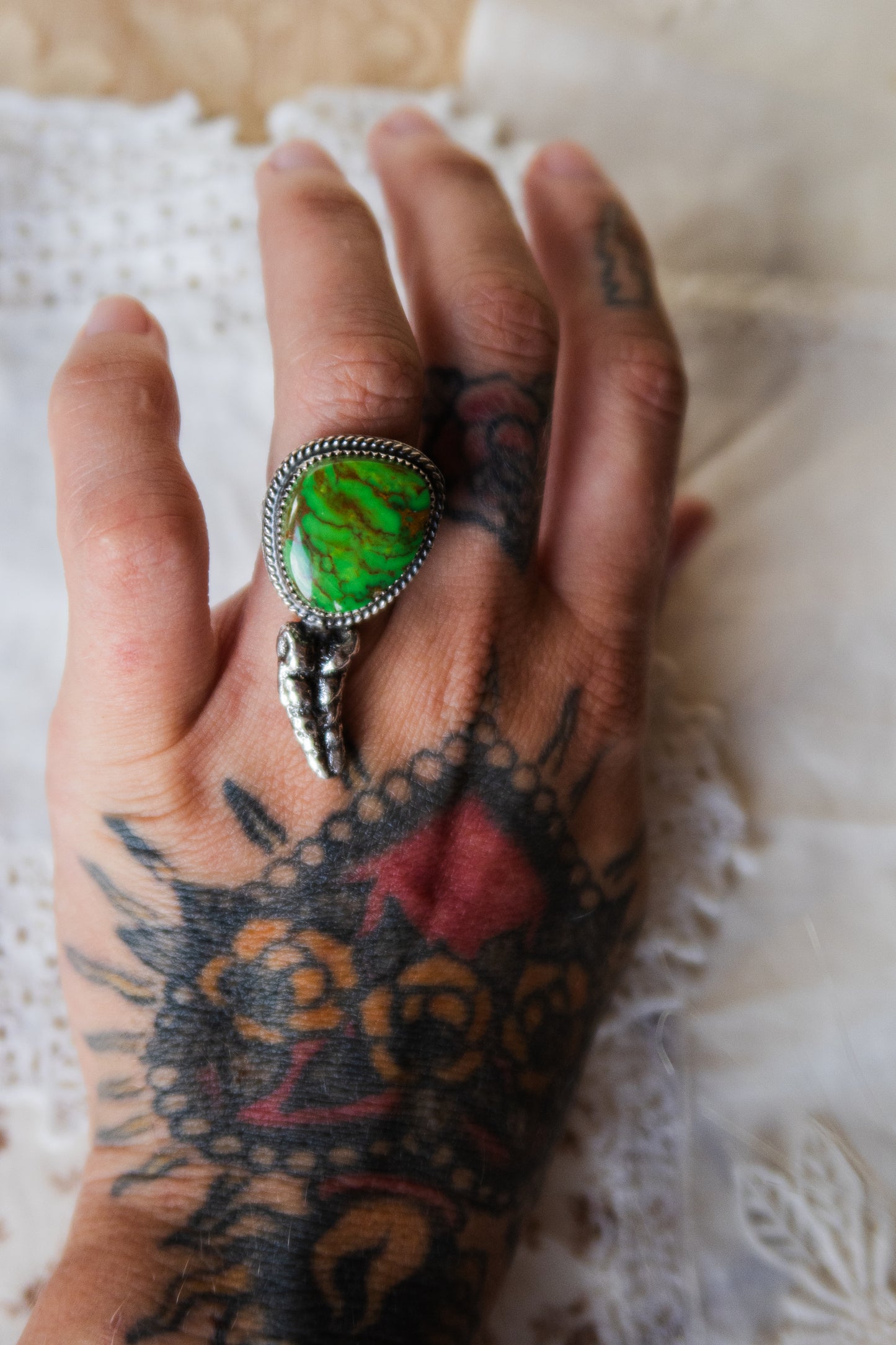 This one-of-a-kind Sterling Silver Kingman Turquoise Rattler Ring is handcrafted in the heart of South Texas. This whimsical beauty features a striking double ring shank design that wraps around your finger like a coiled serpent, crowned with genuine Kingman turquoise that captures the wild spirit of the south Texas Terrain. Each piece is uniquely crafted, making it a treasure that's as individual as you are.&nbsp;
