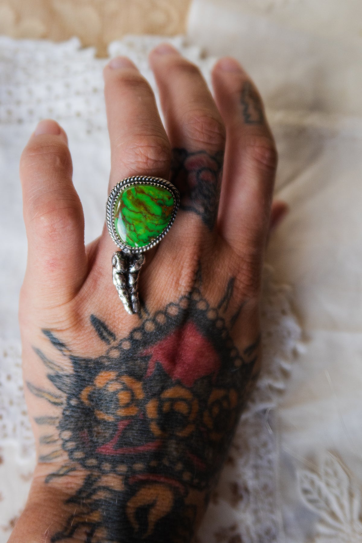 This one-of-a-kind Sterling Silver Kingman Turquoise Rattler Ring is handcrafted in the heart of South Texas. This whimsical beauty features a striking double ring shank design that wraps around your finger like a coiled serpent, crowned with genuine Kingman turquoise that captures the wild spirit of the south Texas Terrain. Each piece is uniquely crafted, making it a treasure that's as individual as you are.&nbsp;