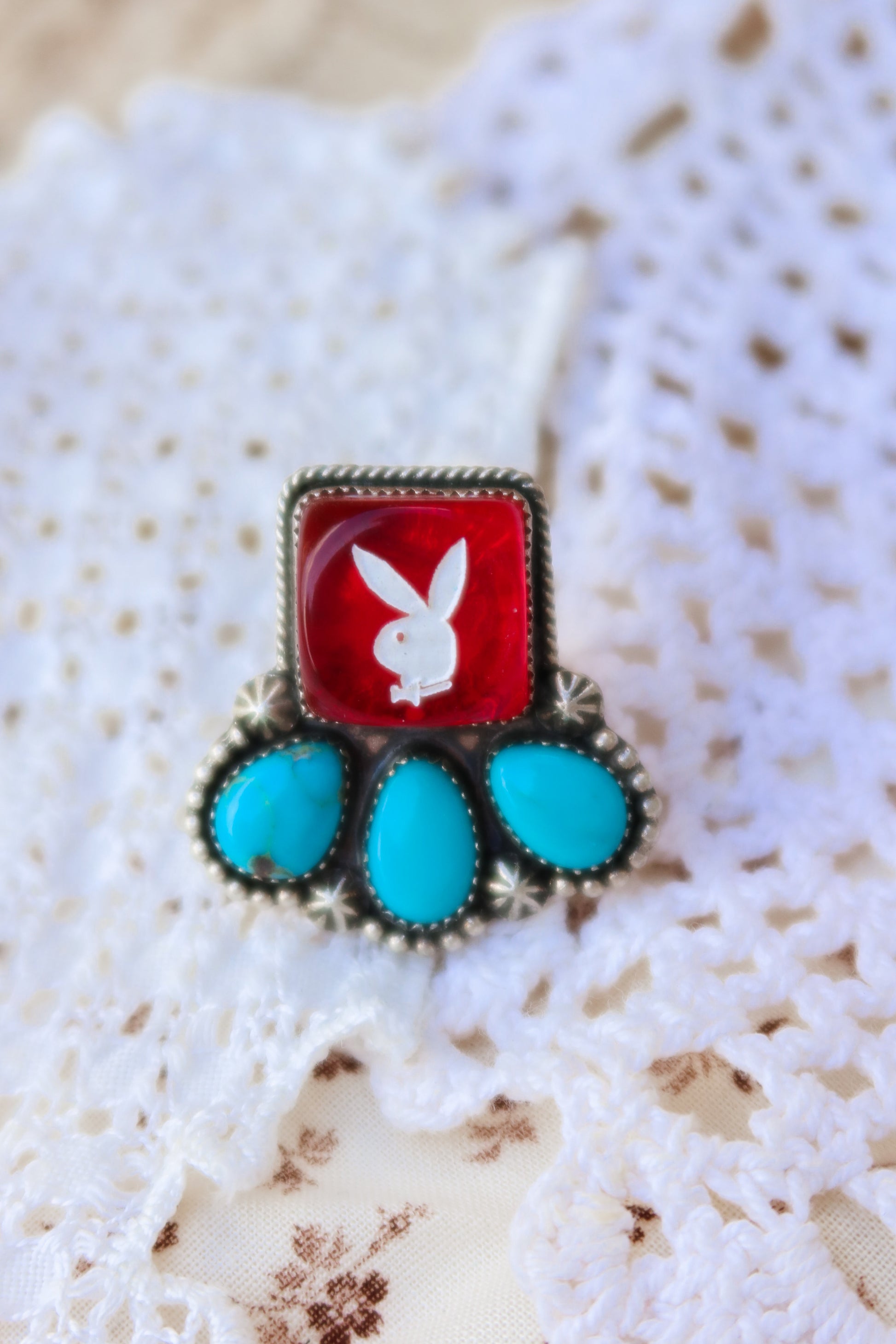 Fun Sterling Silver and Sonoran Turquoise Red Playboy ring. Crafted with sterling silver, this piece features vibrant Sonoran turquoise with a Red playboy dice