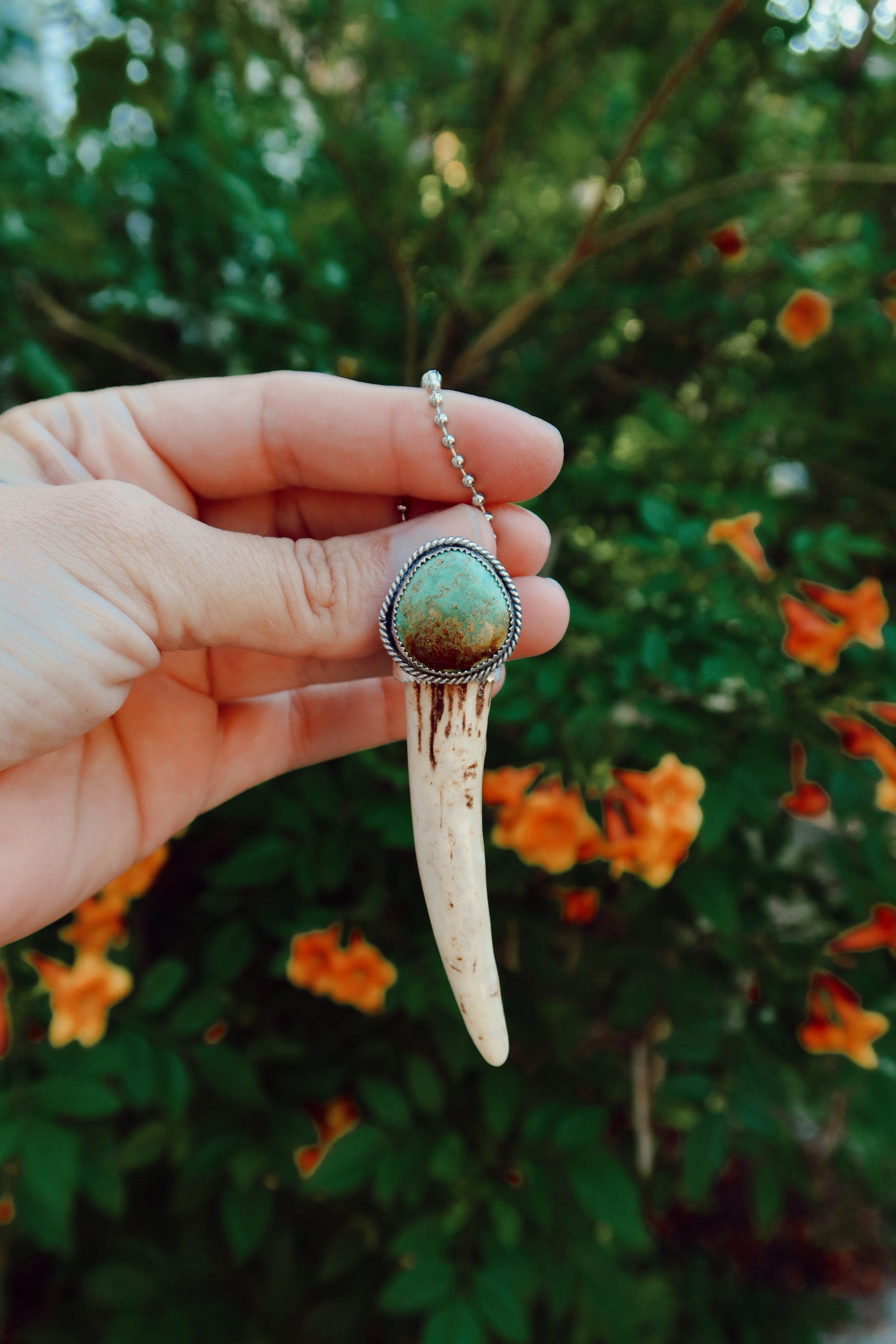Carry a touch of enchantment with this whimsical Sterling Silver and Turquoise Antler Tip Keychain, lovingly handcrafted in South Texas. Let this magical little charm dance from your keys, dangle from your purse, or nestle close to your heart as a pendant. A sprinkle of south Texas charm wherever you wander.
