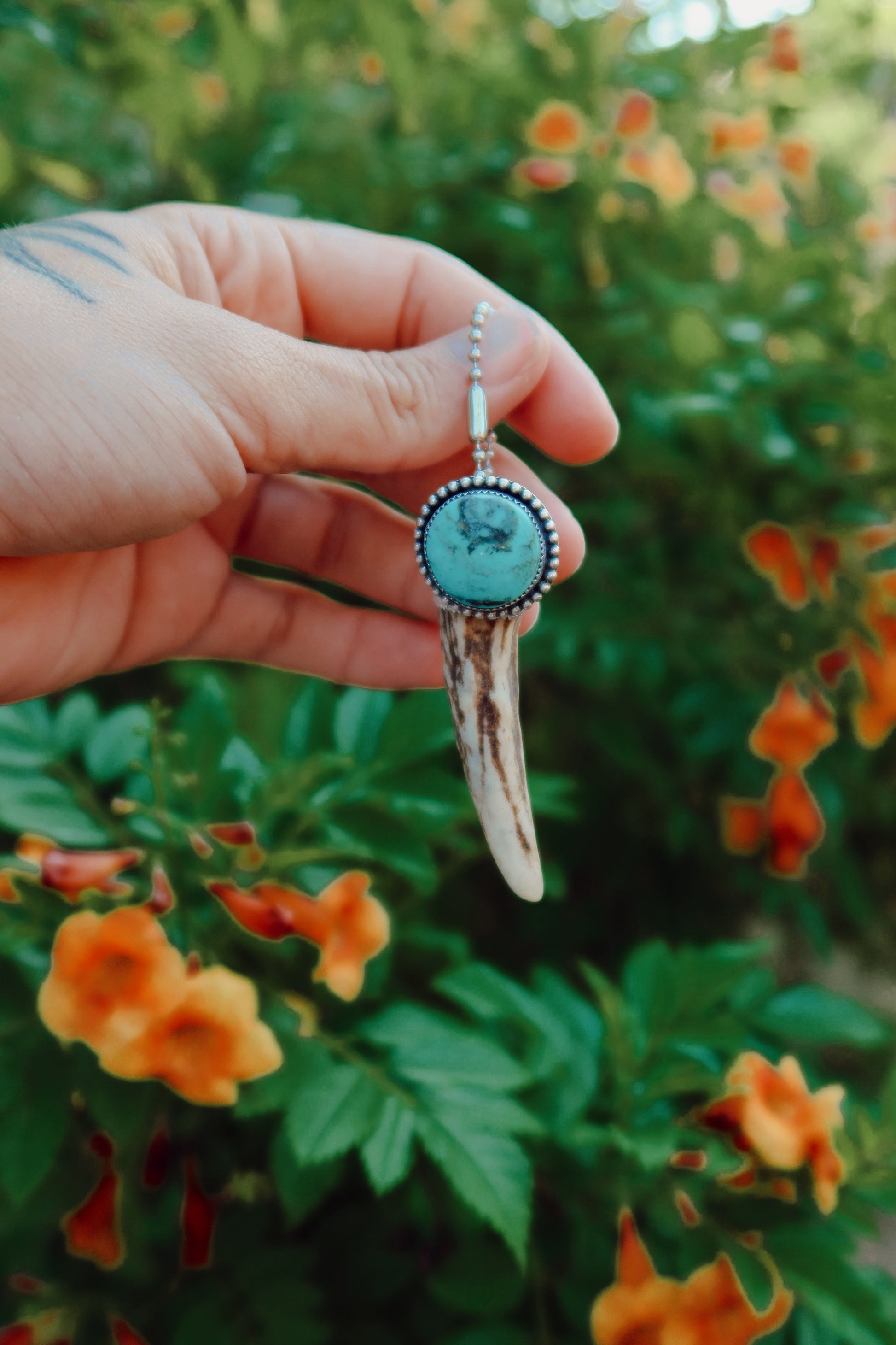 Carry a touch of enchantment with this whimsical Sterling Silver and Turquoise Antler Tip Keychain, lovingly handcrafted in South Texas. Let this magical little charm dance from your keys, dangle from your purse, or nestle close to your heart as a pendant. A sprinkle of south Texas charm wherever you wander.