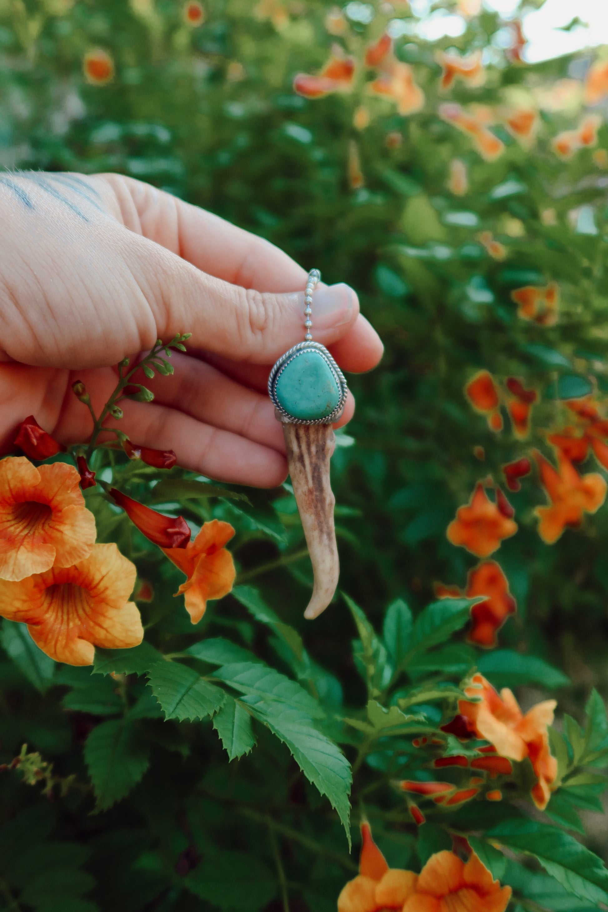 Carry a touch of enchantment with this whimsical Sterling Silver and Turquoise Antler Tip Keychain, lovingly handcrafted in South Texas. Let this magical little charm dance from your keys, dangle from your purse, or nestle close to your heart as a pendant. A sprinkle of south Texas charm wherever you wander.