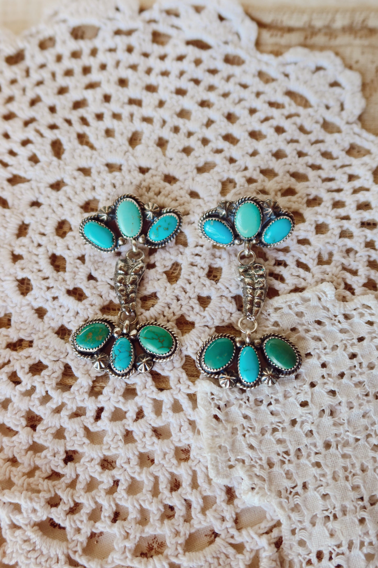 Elevate your style with these whimsical Sterling Silver and Sonoran Turquoise Mix Rattler Earrings—handcrafted right here in South Texas! Each pair features vibrant turquoise stones paired with gleaming sterling silver, creating a unique piece that dances with every move. Perfect for those who love a little personality in their jewelry. Wear them and let your ears do the talking!