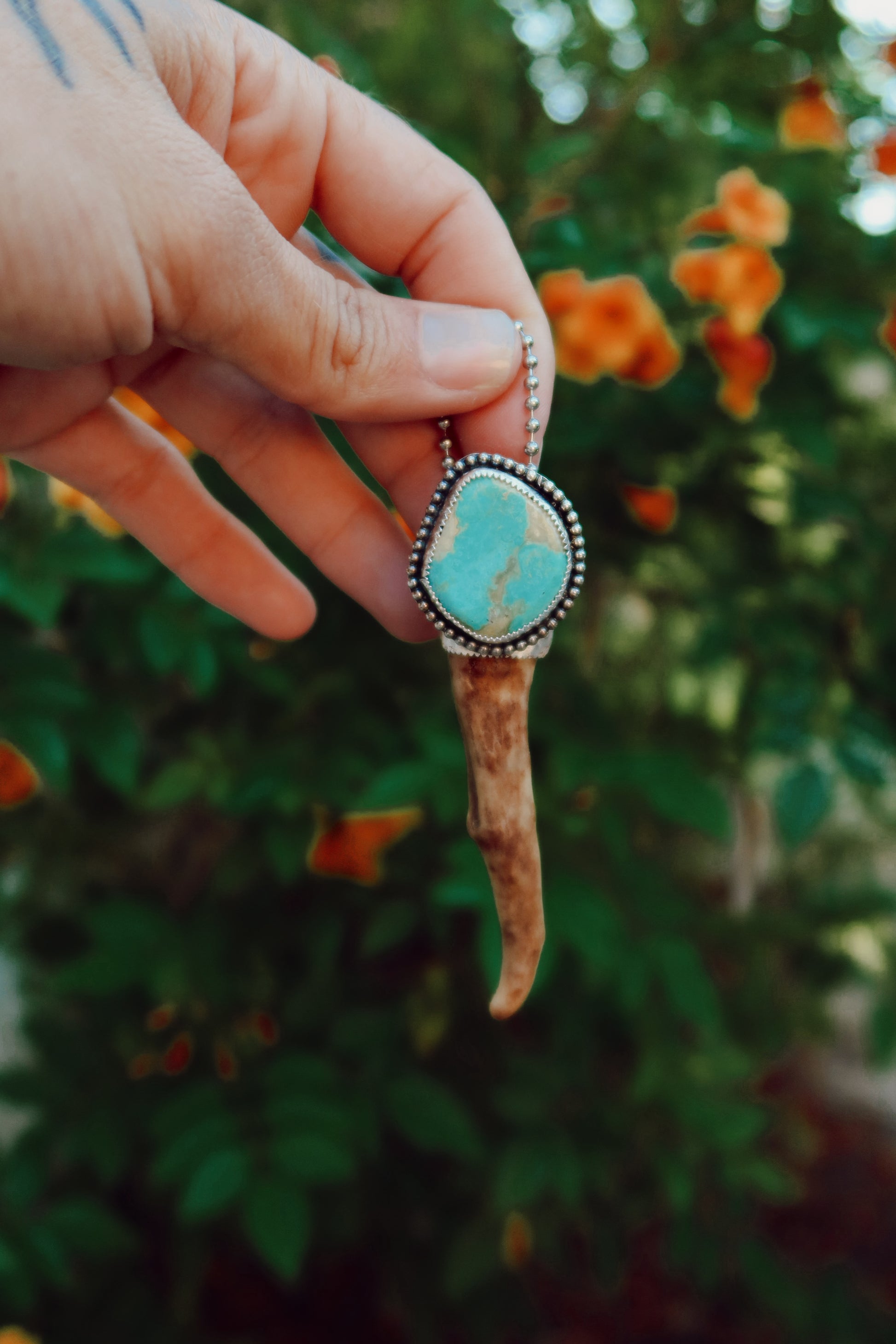 Carry a touch of enchantment with this whimsical Sterling Silver and Turquoise Antler Tip Keychain, lovingly handcrafted in South Texas. Let this magical little charm dance from your keys, dangle from your purse, or nestle close to your heart as a pendant. A sprinkle of south Texas charm wherever you wander.