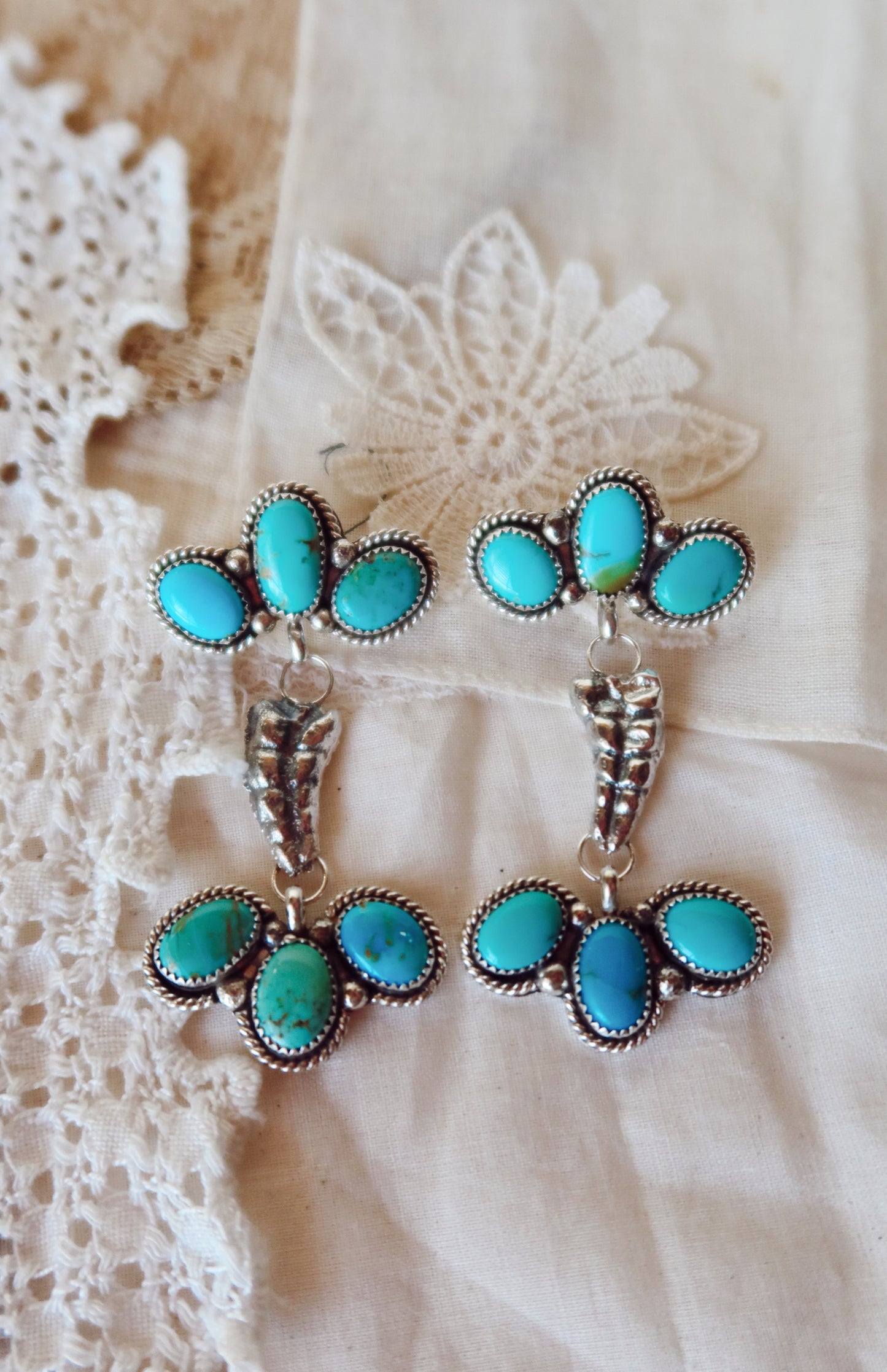 Elevate your style with these whimsical Sterling Silver and Sonoran Turquoise Mix Rattler Earrings—handcrafted right here in South Texas! Each pair features vibrant turquoise stones paired with gleaming sterling silver, creating a unique piece that dances with every move. Perfect for those who love a little personality in their jewelry. Wear them and let your ears do the talking!